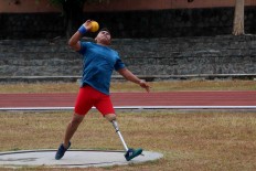 Sutarno throws his shot put during a training session at the Sriwedari Stadion in Surakarta. JP/Maksum Nur Fauzan