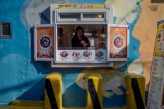 A woman cooks Korean street food in Gamcheon. JP/Anggara Mahendra