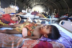A little boy cries from the pain of his injuries at the Undata Hospital in Palu, Central Sulawesi on Thursday, October 4, 2018. JP/Dhoni Setiawan