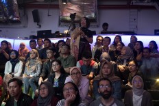 Visitors join in the discussion during the 100 Persen Manusia (100 percent Human) Film Festival at the Institut Français d’Indonésie (IFI). JP/Rosa Panggabean