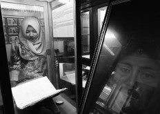 A visitor looks at a manuscript being displayed at an exhibition in Surakarta, Central Java. JP/Ganug Nugroho Adi