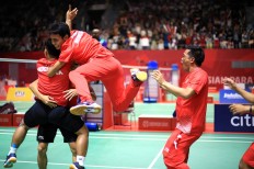 Indonesian badminton players celebrate their victory at the 2018 Asian Para Games during the men’s badminton team final at the Istora Senayan on Sunday, October 7, 2018. Indonesia won its first gold medal by beating Malaysia 2-1. JP/Seto Wardhana