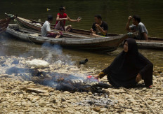 Freshly cooked: Villagers light fire pits on the shoreline that they can immediately cook the caught fish. JP/Tarko Sudiarno