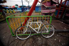 All alone: A bicycle left stranded in the empty chair. JP/Boy T Harjanto