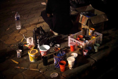 Tools of the trade: Mural artists require lots of paint cannisters to produce their works. JP/Maksum Nur Fauzan