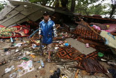 Lost property: A man tries to salvage on Sunday belongings from his home, which was destroyed by a tsunami that hit Carita Beach in Pandeglang, Banten, on Saturday night December 22, 2018. JP/Dhoni Setiawan