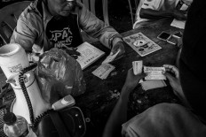Owners register their birds before the race. JP/Anggertimur Lanang Tinarbuko