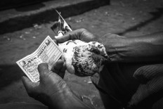 Mantra, a female pigeon owned by Udi Mulyanto, waits for her turn to compete. JP/Anggertimur Lanang Tinarbuko