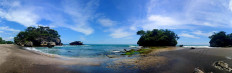 Three giant rocks on Madasari Beach are a popular spot for a photo shoot among tourists. JP/Arya Dipa