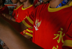 The Garuda Pancasila national logo is printed on the uniforms. JP/Aman Rochman