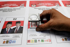 A staff is making sure there is no defect in the ballot papers. JP/Dhoni Setiawan