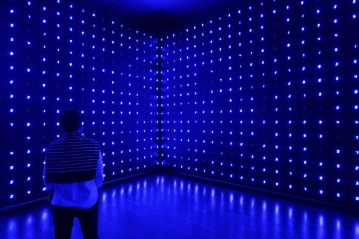 A man looks at an art installation by Japanese artist Tatsuo Miyajima titled 'Mega Death' during an exhibition at the National Gallery on November 19, 2018 in Singapore. 