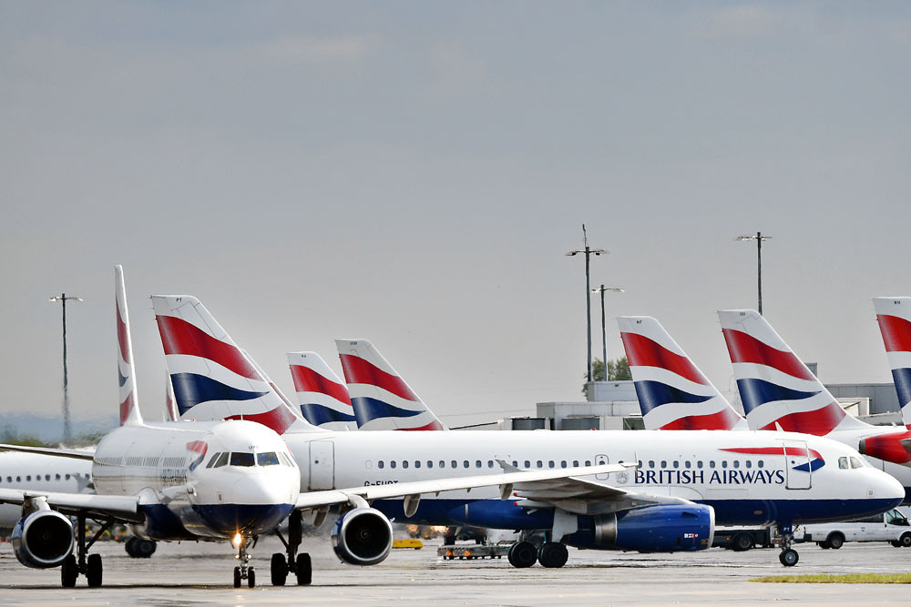British Airways passenger aircrafts are pictured at London Heathrow Airport.