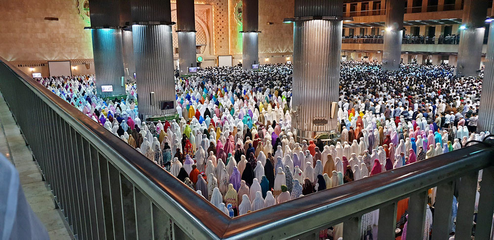 People perform tarawih (evening Ramadan prayers) on the eve of Ramadan at Istiqlal Mosque in Central Jakarta.