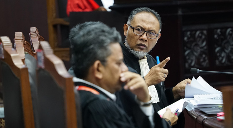 Court begins election appeal hearing, while hundreds crowd area
