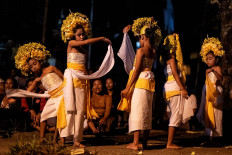 Dancers perform the sacred ritual, during which they dance like goddesses and sway like stems of rice. JP/Agung Parameswara