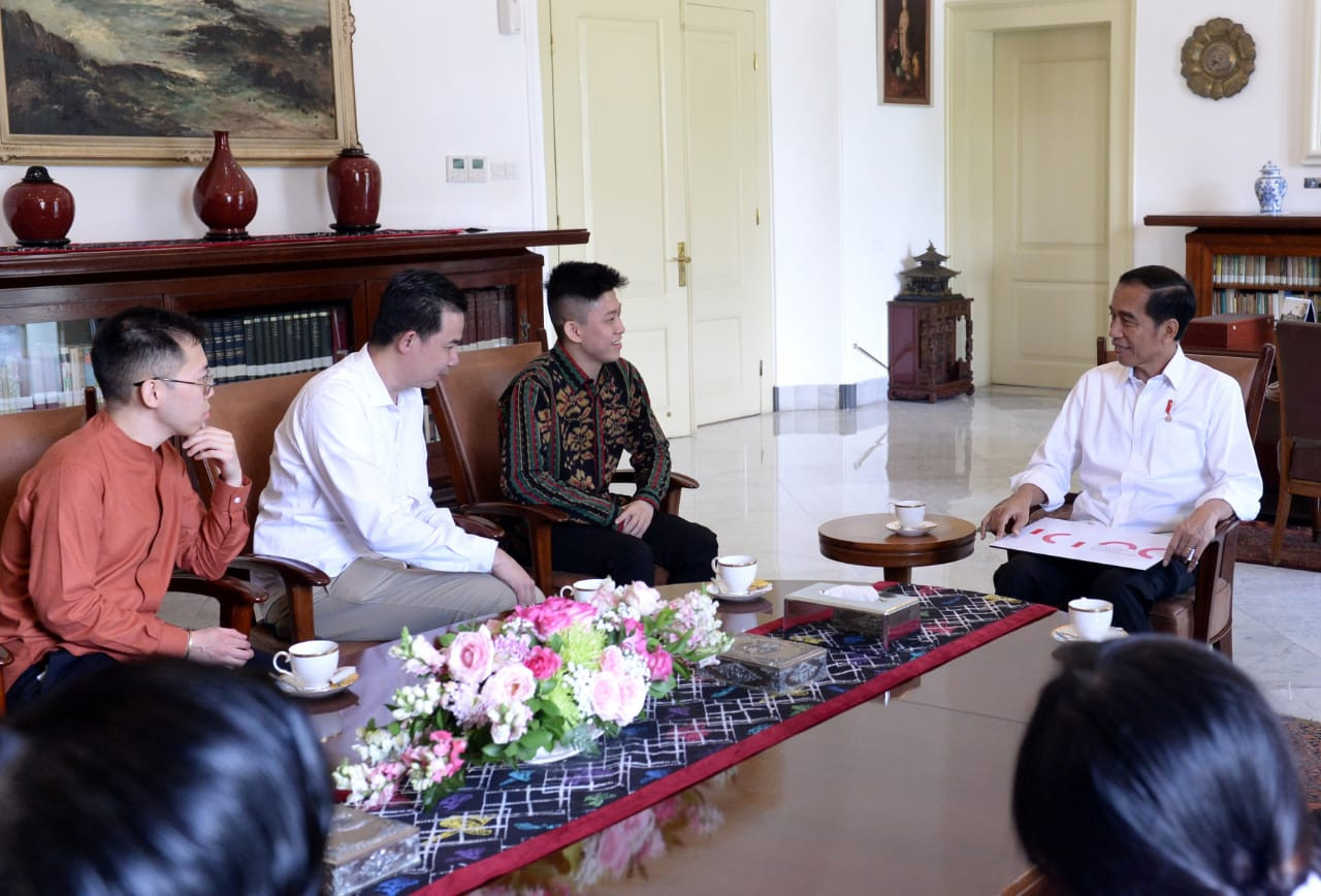 President Joko "Jokowi" Widodo welcomes rapper Rich Brian (in dark batik) at Bogor Palace in West Java on July 7.