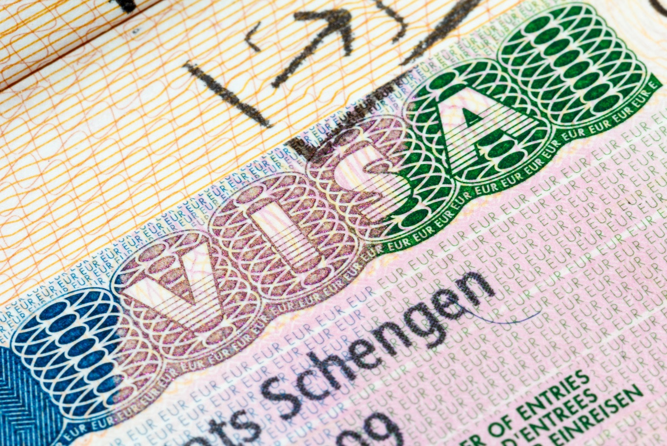 Schengen visa stamp on passport
