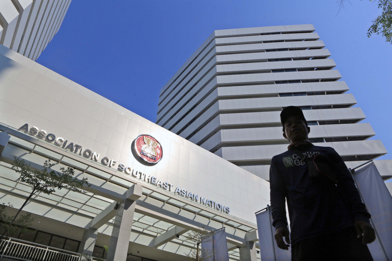 A man walks outside the ASEAN Secretariat building in Jakarta shortly after its inauguration on Aug. 8, 2019. Brunei will chair the ASEAN Summit on Myanmar in Jakarta this weekend.