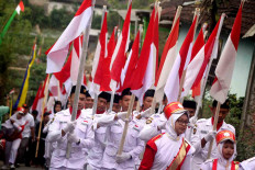 The National Flag Hoisting Team carries the national flag. JP/Maksum Nur Fauzan