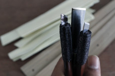 A pangrupak is a writing tool used for palm leaf script. The shape differs from a ballpoint pen, as it needs to be pressed by two thumbs while writing on the palm leaves.  JP/Arya Dipa