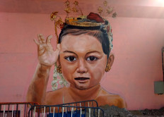 Mural on the south part of the Manahan overpass displays a child character. JP/Ganug Nugroho Adi