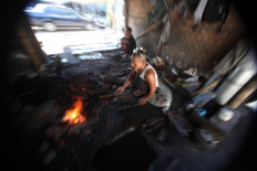The metal must be heated before being hammered into shape. JP/Boy T. Harjanto