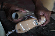 Prosthetics are carefully packaged to be delivered from Karanganyar, Central Java. JP/Magnus Hendratmo