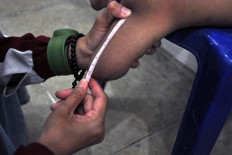 Careful measurement is crucial for creating a prosthetic that is comfortable to wear. JP/Magnus Hendratmo