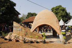 Residents walk around the museum on its inauguration day on Aug. 16. The museum is the first building of a terracotta-based development project in Majalengka, one of the 10 creative towns planned by the Creative Economy Agency (Bekraf). JP/Arya Dipa.