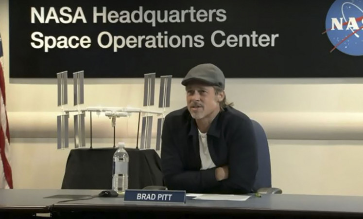 Who calls the tunes in space? Brad Pitt asks NASA astronaut 