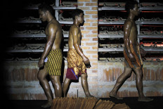 Competitors take to the stage during the 2019 Jatiwangi Cup bodybuilding championship at the Dua Saudara jebor in Burujul Kulon, Majalengka, West Java. For the first time since it was first staged in 2015 the annual championship was held at night because it coincided with the Islamic Day of Sacrifice. JP/Arya Dipa