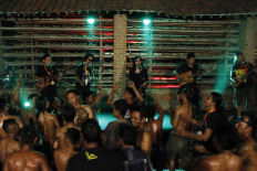 Participants in the 2019 Jatiwangi Cup bodybuilding championship dance en masse as the band Lair performs at the Dua Saudara jebor in Burujul Kulon, Majalengka, West Java, recently. The annual championship has become an entertaining event for locals of different ages. JP/Arya Dipa