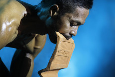 Each competitor has his own style of flaunting muscles as he poses in front of the team of judges during the 2019 Jatiwangi Cup bodybuilding championship at the Dua Saudara jebor, Burujul Kulon, Majalengka, West Java. The team comprised four judges who were previous champions of the Jatiwangi Cup, held since 2015. JP/Arya Dipa