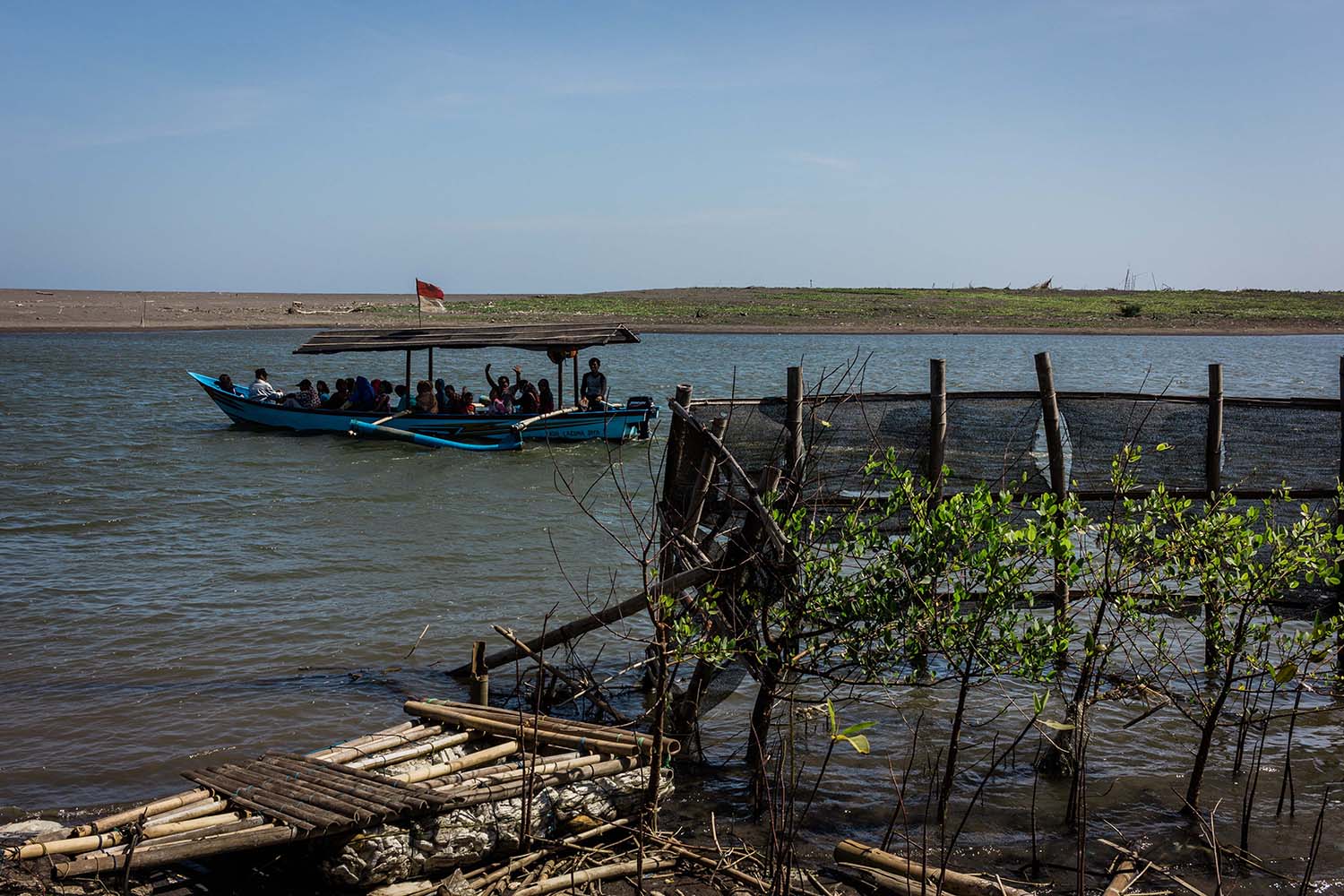 Tourists riding a motorboat wave while enjoying an ecotourism package in the Baros Mangrove area. JP/Anggertimur Lanang Tinarbuko