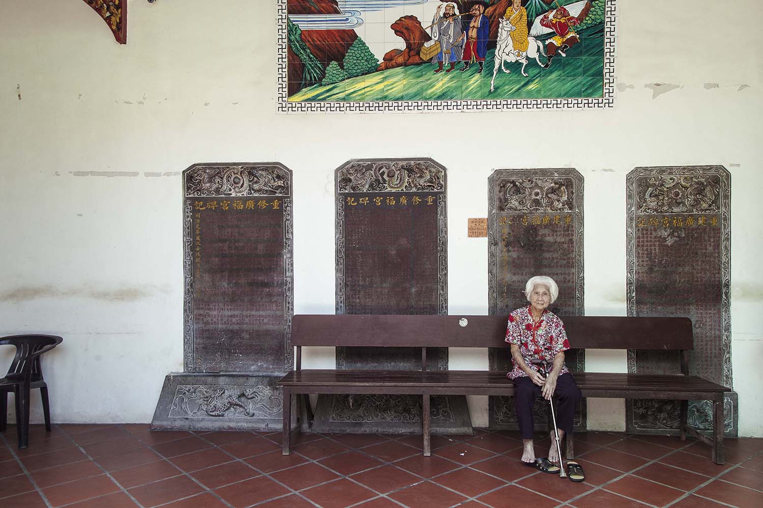 An elderly woman sits in the Goddess of Mercy Temple. The temple is one of the most popular Chinese temples in Penang. JP/Irene Barlian