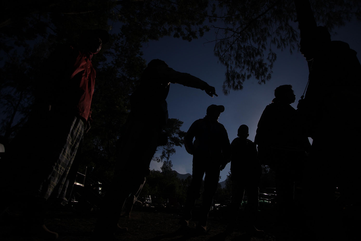 Silhouettes of cart handlers as they wait for travelers. JP/Boy T  Harjanto