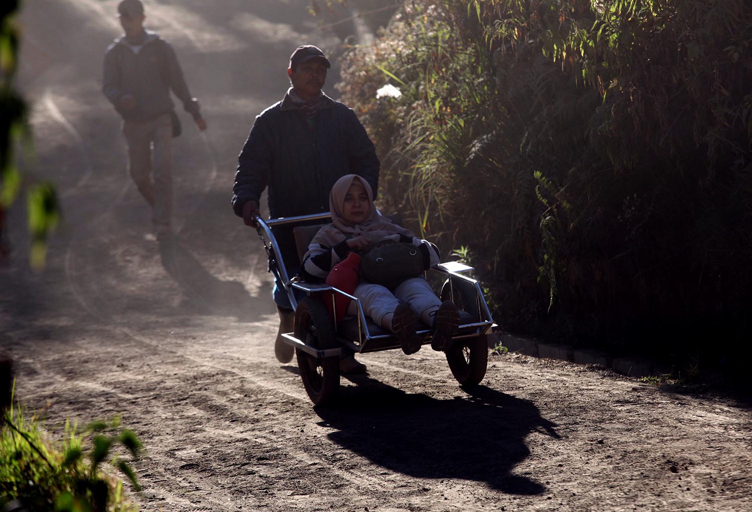 Transporting travelers down the mountain. JP/Boy T Harjanto