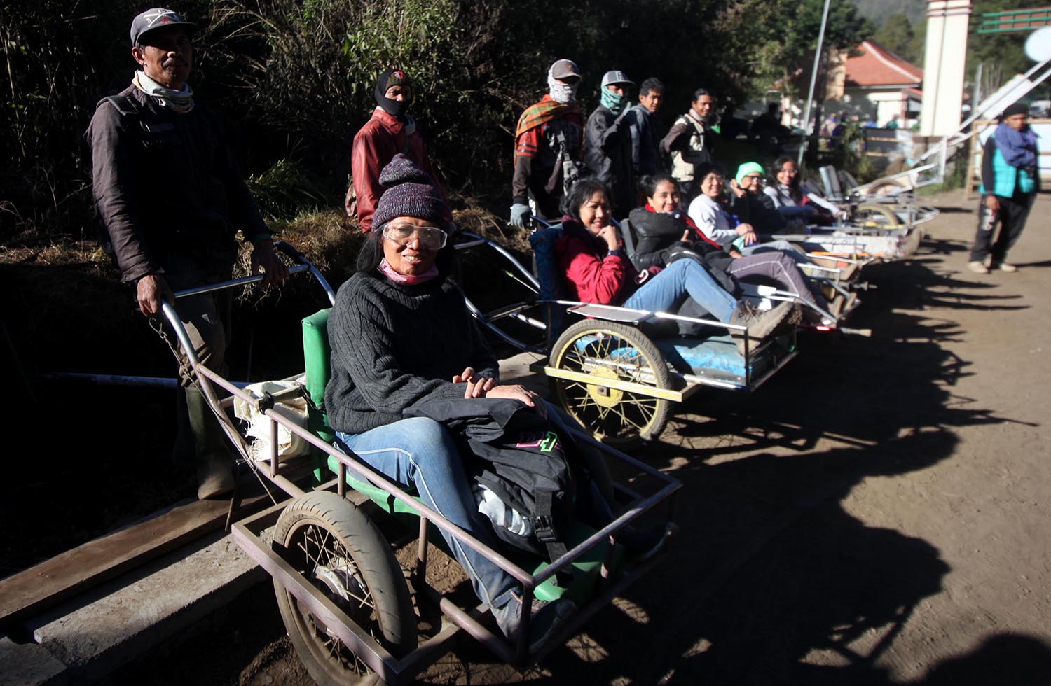 Travelers pose for a picture after riding the carts. JP/Boy T Harjanto