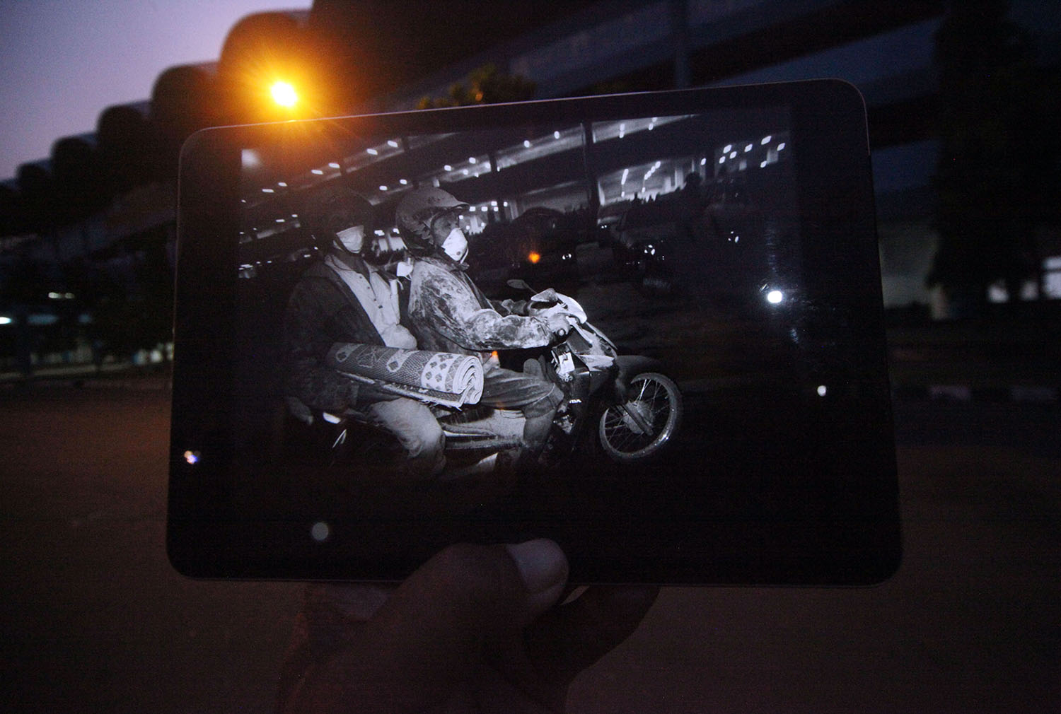 Two villagers ride a motorcycle to find safety at the Maguwoharjo Stadium. JP/ Boy T Harjanto