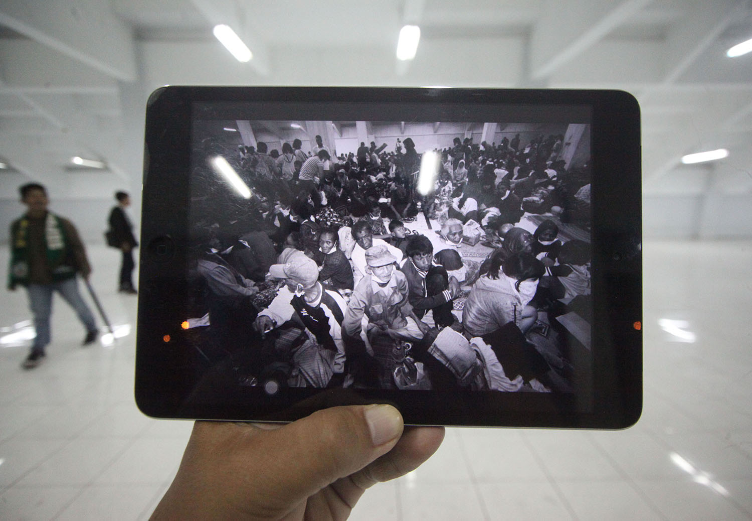 A supporter of PSS Sleman passes through a room under the stands used to host victims of the Mt. Merapi eruption in 2010. JP/ Boy T Harjanto