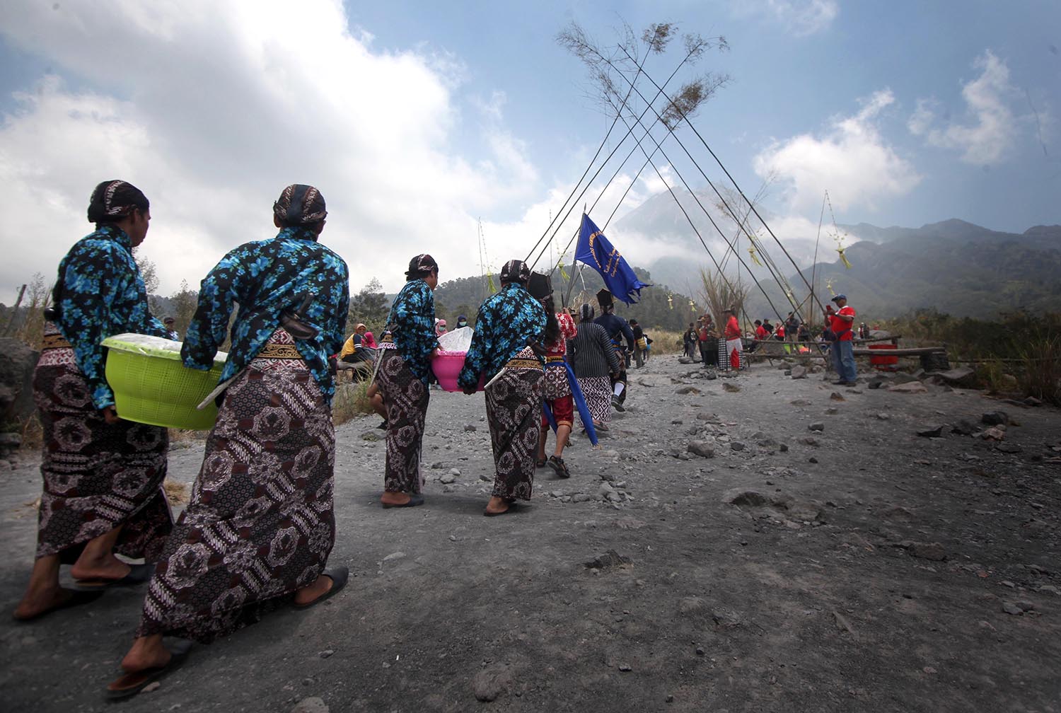 Residents carry food during Merapi Kenduri in Kaliadem Village, Sleman, Central Java, on Oct. 14, 2019. The village is around 4.5 kilometers away from the top of Mount Merapi. JP/Boy T Harjanto