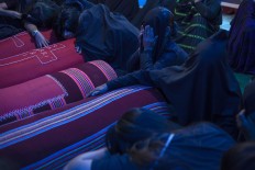 Family members weep for their loved ones. JP/Yusuf Wahil