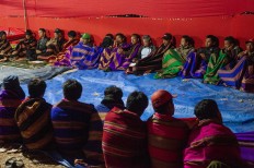 Family members are joined in a night prayer before the mangngaro ritual begins. JP/Yusuf Wahil