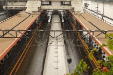 Railways tracks at Tanah Abang Station in Tanah Abang, Central Jakarta, are inundated with water on Jan. 1. JP/Dionnasius Aditya
