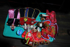 Green room: A set of wayang potehi (glove puppets) are ready to be used in a show. JP/Maksum Nur Fauzan