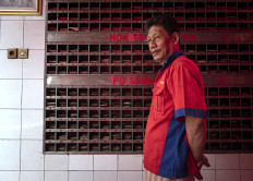 Lukman “Silay” Susanto has worked for 20 years as a temple caretaker, as well as a guide for visitors as they say their prayers. JP/Bismo Agung