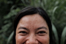 A volunteer named Ima joins the banyan tree planting at Lesung Hill, Buleleng, Bali. JP/Anggara Mahendra
