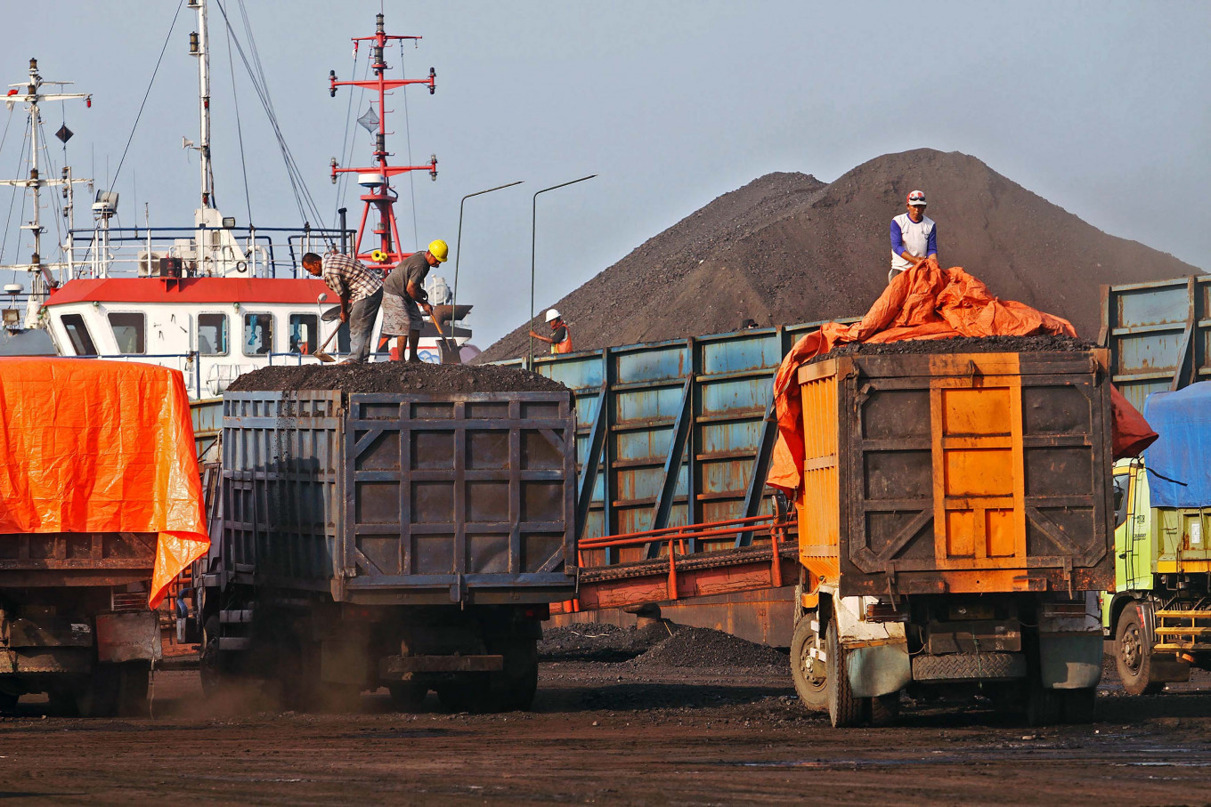 Workers load coal at Cirebon Port in West Java in this file photo.