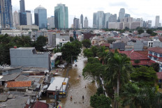 Atlantis for a day: Bendungan Hilir is seen flooded in Central Jakarta on Tuesday. JP/Donny Fernando